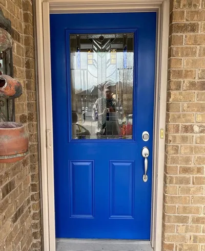 Front door painted a bold royal blue
